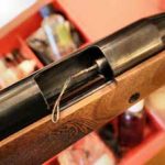 Cleaning an air rifle barrel with a pull through